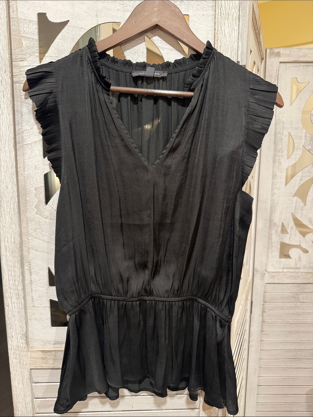 Sleeveless Black Ruffle-Trim V-Neck Peplum Blouse